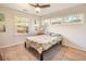 Sunny bedroom with large windows, light floors, and stylish bedding at 1230 Hawthorne Cir, Hanahan, SC 29410