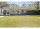 Charming single-story home with a well-maintained lawn and mature landscaping at 1230 Hawthorne Cir, Hanahan, SC 29410