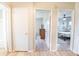 Hallway with access to multiple rooms and showing continuity of the home's layout at 1230 Hawthorne Cir, Hanahan, SC 29410