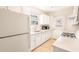 Kitchen with white cabinetry, stainless steel sink, and modern appliances at 1230 Hawthorne Cir, Hanahan, SC 29410