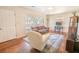 Inviting living room with hardwood floors, comfortable seating, and large windows at 1230 Hawthorne Cir, Hanahan, SC 29410