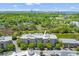 Stunning aerial view of property showcasing mature trees, lakes, and manicured landscaping on a sunny day at 125 Pier View St # 405, Daniel Island, SC 29492