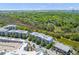 Aerial view of the apartment community surrounded by green space and pond views at 125 Pier View St # 405, Daniel Island, SC 29492
