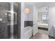Stylish bathroom features a shower and separate tub with modern finishes and an adjoining bedroom at 125 Pier View St # 405, Daniel Island, SC 29492