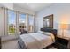 Inviting bedroom with large windows and natural light, neutral walls, and comfortable furniture at 125 Pier View St # 405, Daniel Island, SC 29492
