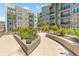 Lush courtyard featuring manicured greenery and walkways, offering a serene outdoor space for residents at 125 Pier View St # 405, Daniel Island, SC 29492