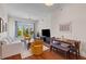 Bright living room with a ceiling fan, hardwood floors and natural light filling the space at 125 Pier View St # 405, Daniel Island, SC 29492