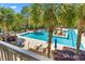 Relaxing pool area featuring lounge chairs and palm trees for a resort-style experience at 125 Pier View St # 405, Daniel Island, SC 29492
