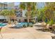 Resort-style pool area with palm trees and comfortable lounge seating for relaxation and enjoyment at 125 Pier View St # 405, Daniel Island, SC 29492