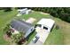 Aerial view of a single-Gathering home, boasting a detached garage, sheds, and serene atmosphere surrounded by nature at 131 Travis Hill Rd, Moncks Corner, SC 29461
