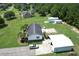A charming single-Gathering home with spacious yard and large detached garage, surrounded by lush greenery and mature trees at 131 Travis Hill Rd, Moncks Corner, SC 29461