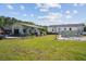 Spacious backyard with a garage, covered patio, and above-ground pool, perfect for outdoor living and entertaining at 131 Travis Hill Rd, Moncks Corner, SC 29461