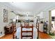 Spacious kitchen with white cabinets, ample counter space, and dining area at 131 Travis Hill Rd, Moncks Corner, SC 29461