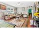 Charming living room featuring hardwood floors, classic furniture, and decorative rug at 131 Travis Hill Rd, Moncks Corner, SC 29461