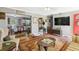 Inviting living room with hardwood floors, vintage furniture, and an open view to the kitchen and dining area at 131 Travis Hill Rd, Moncks Corner, SC 29461