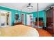 Comfortable main bedroom with a four-poster bed, hardwood floors, and ample storage at 131 Travis Hill Rd, Moncks Corner, SC 29461