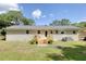 View of the backyard, deck, and back exterior of this brick home at 1317 White Dr, Charleston, SC 29407