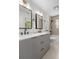 Bathroom featuring a double vanity with matte black faucets and framed mirrors at 1317 White Dr, Charleston, SC 29407
