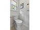 Bathroom featuring a toilet and hexagonal tile flooring by a window at 1317 White Dr, Charleston, SC 29407