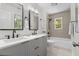 Bathroom featuring a double vanity with matte black faucets and framed mirrors at 1317 White Dr, Charleston, SC 29407