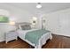 Bright bedroom with hardwood floors and natural light, adjacent bathroom at 1317 White Dr, Charleston, SC 29407