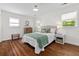 Bright bedroom with hardwood floors, neutral walls, and natural light from the windows at 1317 White Dr, Charleston, SC 29407