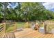 New deck overlooking a sprawling backyard with a full tree line and privacy fence at 1317 White Dr, Charleston, SC 29407