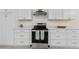 Contemporary kitchen features white cabinets and stainless steel appliances at 1317 White Dr, Charleston, SC 29407