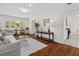 Bright living room with hardwood floors, neutral colors, and views to the kitchen at 1317 White Dr, Charleston, SC 29407