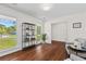 Well-lit living room with hardwood floors, large windows, and minimalist decor at 1317 White Dr, Charleston, SC 29407