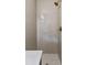 Shower stall with bronze fixtures and neutral tile from floor to ceiling at 1317 White Dr, Charleston, SC 29407