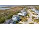 Aerial shot showcases the home nestled in a coastal community with marsh views at 1502 Menhaden Ln, Mount Pleasant, SC 29466
