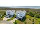 An elevated view of the property showing the beautiful light blue home near a marsh at 1502 Menhaden Ln, Mount Pleasant, SC 29466