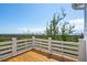 Balcony with wood floors and white rails with views of water and marsh landscape at 1502 Menhaden Ln, Mount Pleasant, SC 29466
