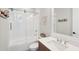 Bright bathroom featuring a shower over tub, white subway tiles, and decorative coastal themed accents at 1502 Menhaden Ln, Mount Pleasant, SC 29466