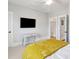 Neutral bedroom featuring a desk, TV, ceiling fan and access to more rooms at 1502 Menhaden Ln, Mount Pleasant, SC 29466