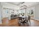 Open dining area with modern light fixtures, island seating, and lots of natural light at 1502 Menhaden Ln, Mount Pleasant, SC 29466
