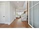 Bright entryway with hardwood floors, a staircase, and an open view to a living room at 1502 Menhaden Ln, Mount Pleasant, SC 29466