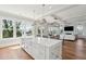 Bright open kitchen with island seating and a view to the ocean and living room at 1502 Menhaden Ln, Mount Pleasant, SC 29466