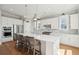 Modern kitchen with white cabinetry, stainless steel appliances, and a large center island at 1502 Menhaden Ln, Mount Pleasant, SC 29466