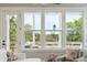 Living room with large windows providing natural light and views of the outdoors at 1502 Menhaden Ln, Mount Pleasant, SC 29466