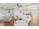 Open-concept living room with hardwood floors, comfortable seating, and lots of natural light at 1502 Menhaden Ln, Mount Pleasant, SC 29466