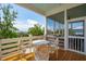 Outdoor screened porch with table and chairs, perfect for enjoying the views at 1502 Menhaden Ln, Mount Pleasant, SC 29466