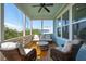 Inviting screened porch with comfortable seating and views of the surrounding landscape at 1502 Menhaden Ln, Mount Pleasant, SC 29466