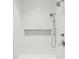 Modern shower boasts white subway tile, a built in shower niche, and chrome fixtures at 1502 Menhaden Ln, Mount Pleasant, SC 29466