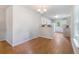 Bright dining area with wood floors and view into the adjacent white kitchen at 151 Tyger St, Summerville, SC 29485
