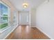 Bright foyer featuring wood floors, a white front door, and plentiful natural light at 151 Tyger St, Summerville, SC 29485