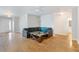 Open living room with wood floors, a ceiling fan, and a comfortable gray sectional sofa at 151 Tyger St, Summerville, SC 29485