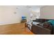 Spacious living room featuring wood floors, a cozy couch, and a modern TV setup at 151 Tyger St, Summerville, SC 29485
