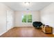Bright room features hardwood floors, and a papasan chair, complemented by a backyard view at 151 Tyger St, Summerville, SC 29485